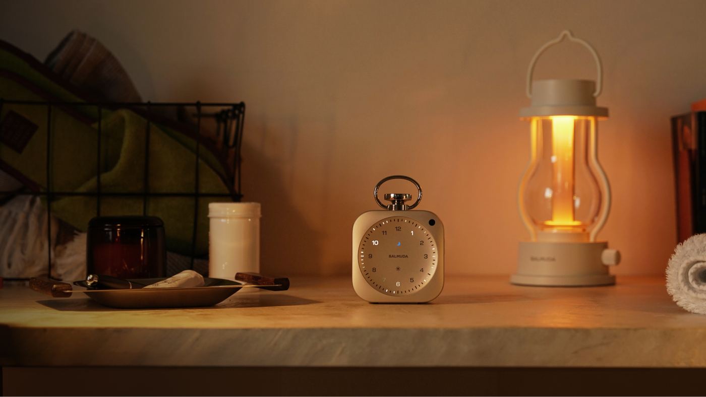 BALMUDA The Clock and The Lantern on a shelf in warm evening light
