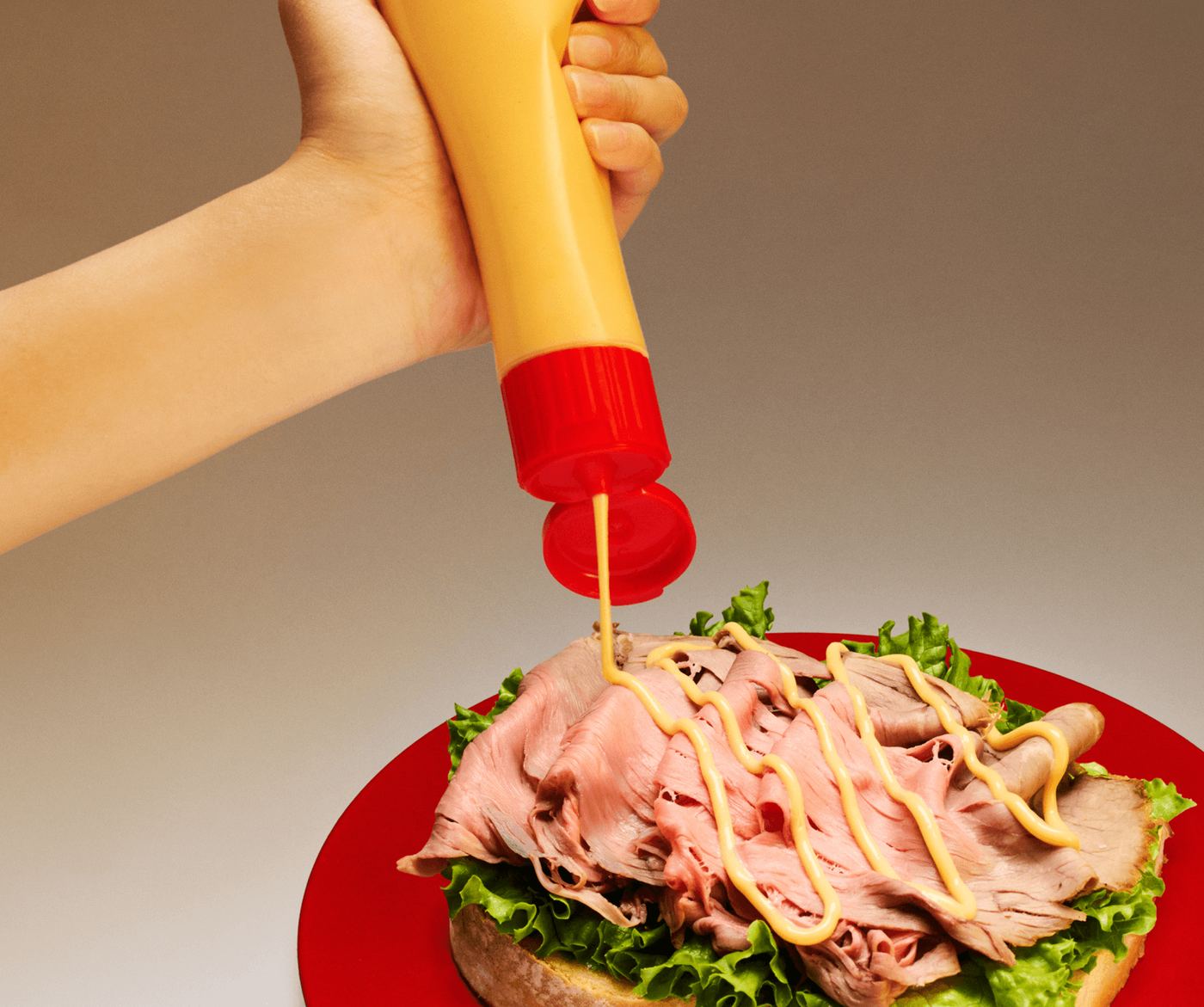CABI mayo squeezed over a roast beef sandwich