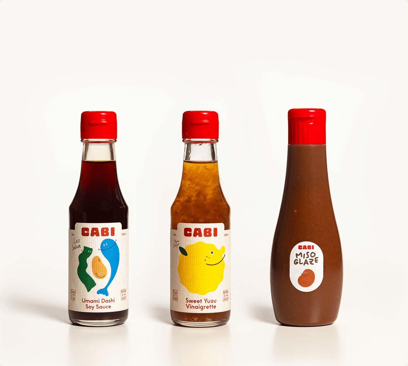 CABI Umami Dashi Soy Sauce, Sweet Yuzu Vinaigrette and Miso Glaze bottles