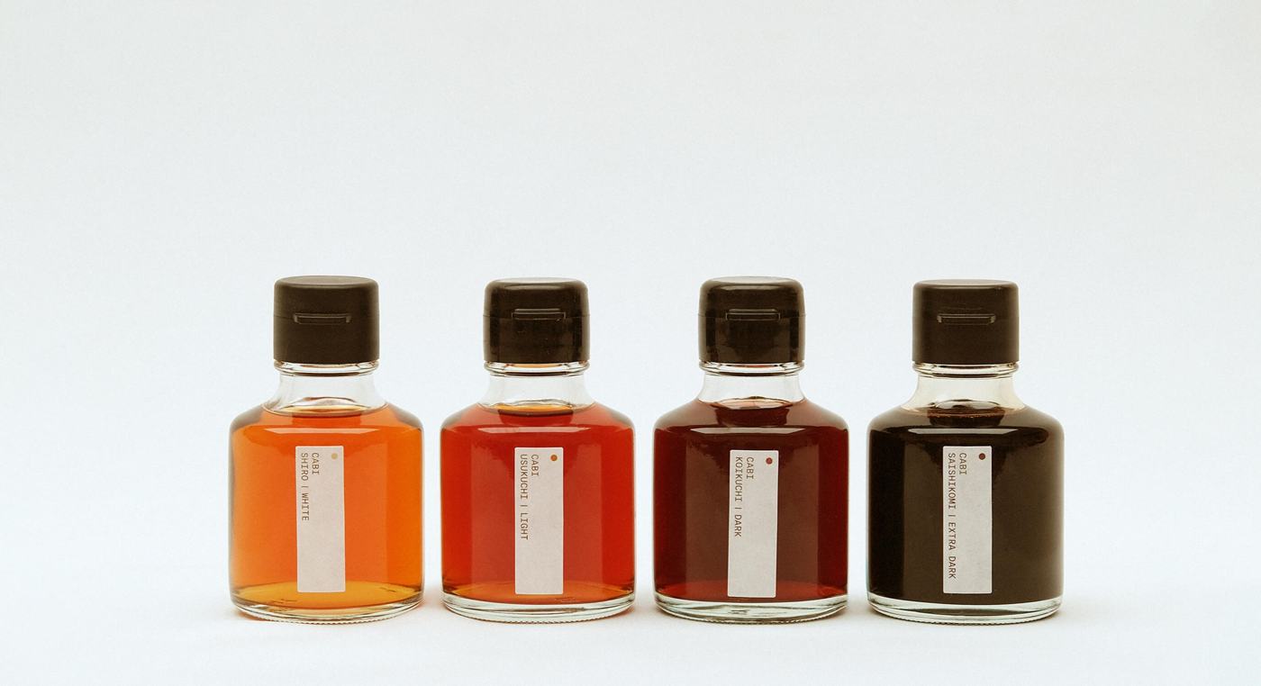 Soy sauces in a row, from light amber to near-black