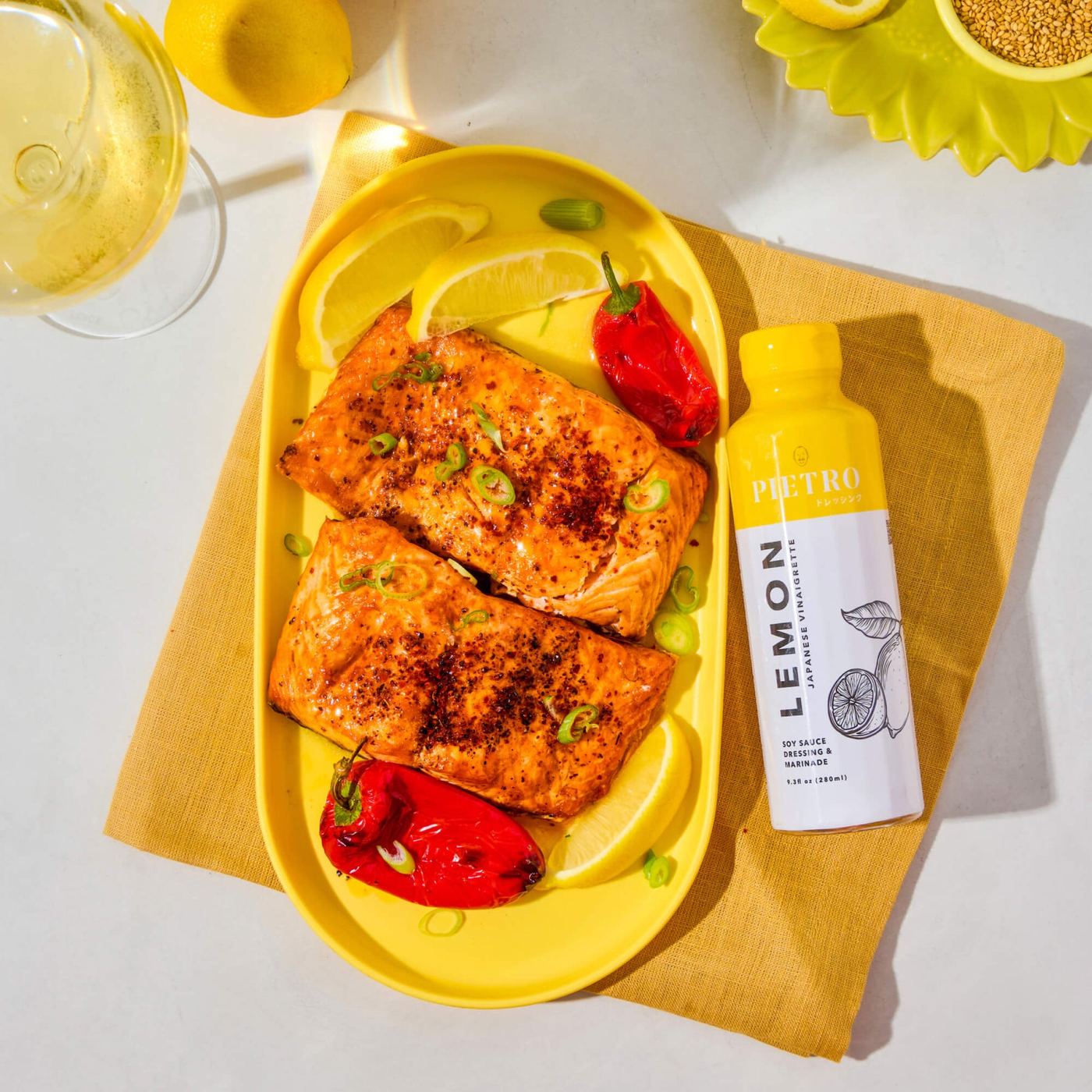 Roasted salmon with lemon wedges and PIETRO Lemon